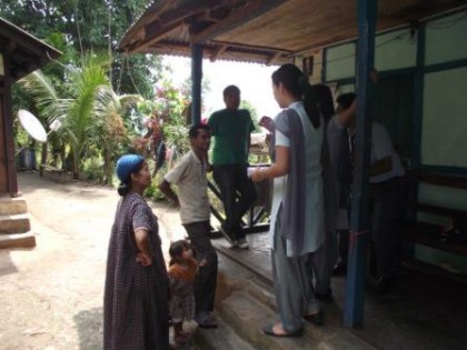 Students distributing the Medicin Kit to the villager